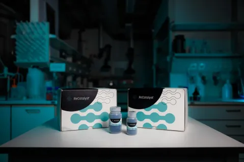 recatalyst product and packaging on table in front of lab in blue light