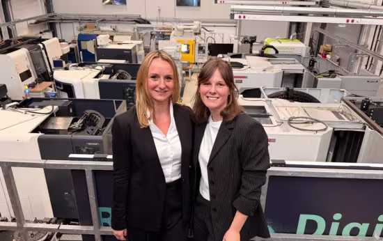 the two founders of factory maker in front of factory