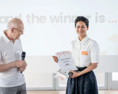xBio Demo day winner Gunpreet Oberoi holding her winning certificate