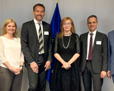 A group picture of the participants in front of EU flag